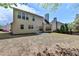 Exterior home backyard featuring a well-maintained lawn and lush landscaping at 580 Hammersmith Dr, Suwanee, GA 30024