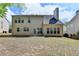 Expansive backyard with a well-maintained lawn and the rear of the house visible at 580 Hammersmith Dr, Suwanee, GA 30024