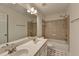 Bathroom with double sink vanity, tile flooring, and shower-tub combination at 580 Hammersmith Dr, Suwanee, GA 30024