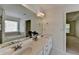 A bathroom features double sinks, and a separate tub area at 580 Hammersmith Dr, Suwanee, GA 30024