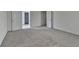 Neutral bedroom showcasing soft carpeting and an open doorway at 580 Hammersmith Dr, Suwanee, GA 30024