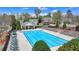 A community pool featuring lounge chairs, a pool house, and clear blue water awaits residents on a hot day at 580 Hammersmith Dr, Suwanee, GA 30024