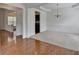 Elegant dining room with chair rail, tray ceiling, and chandelier. View into adjacent room at 580 Hammersmith Dr, Suwanee, GA 30024