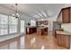 Bright kitchen featuring hardwood floors, an island, granite counters, and stainless steel appliances at 580 Hammersmith Dr, Suwanee, GA 30024