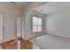 Spacious living room with hardwood floors, fresh paint, natural light, and an open layout at 580 Hammersmith Dr, Suwanee, GA 30024