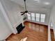Cozy living room space with fireplace and high ceilings allowing for natural light to flood the space at 580 Hammersmith Dr, Suwanee, GA 30024