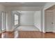 Spacious living room with hardwood floors, fresh paint, natural light, and an open layout at 580 Hammersmith Dr, Suwanee, GA 30024