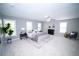 Spacious bedroom features neutral walls and plush gray carpet, with windows providing ample natural light at 909 Otter Ne Way, Marietta, GA 30068