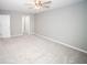 A spacious room features neutral walls and carpet with a ceiling fan at 909 Otter Ne Way, Marietta, GA 30068