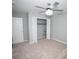 A roomy bedroom featuring neutral walls and carpet and a ceiling fan at 909 Otter Ne Way, Marietta, GA 30068