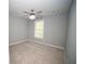 A roomy bedroom featuring neutral walls and carpet and a ceiling fan at 909 Otter Ne Way, Marietta, GA 30068