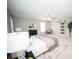 This bedroom features neutral walls, modern ceiling fan, and barn door access to the primary bathroom at 909 Otter Ne Way, Marietta, GA 30068