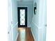 Welcoming entryway with a dark front door featuring decorative glass and light gray walls at 909 Otter Ne Way, Marietta, GA 30068