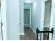 Upstairs hallway with laminate flooring and neutral paint, leading to bedrooms and other rooms at 909 Otter Ne Way, Marietta, GA 30068