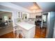 Well-lit kitchen with white quartz countertops, stainless steel appliances, and an eat-in island at 909 Otter Ne Way, Marietta, GA 30068