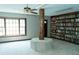 Cozy library featuring a full wall of bookshelves, and natural light at 909 Otter Ne Way, Marietta, GA 30068