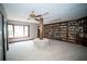 Spacious library with floor to ceiling bookshelves, a large window, and a unique center pillar at 909 Otter Ne Way, Marietta, GA 30068