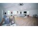 Open-concept living room with vaulted ceilings, wood floors, and modern decor at 909 Otter Ne Way, Marietta, GA 30068