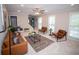 Living room features a decorative fireplace, neutral paint and three windows for natural light at 909 Otter Ne Way, Marietta, GA 30068