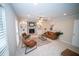 Bright living room featuring a fireplace, neutral walls, carpet and stylish decor at 909 Otter Ne Way, Marietta, GA 30068