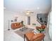 Well-lit living room with a cozy seating area, neutral walls and plush carpet at 909 Otter Ne Way, Marietta, GA 30068