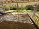 Relaxing porch with a comfortable rope hammock and scenic views of the well maintained backyard at 2470 Woodmere Dr, Marietta, GA 30068