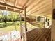 Lovely back porch featuring natural lighting, rustic wood flooring, and an outdoor view of the landscape at 2470 Woodmere Dr, Marietta, GA 30068