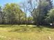 Expansive backyard with lush lawn, mature trees, and plenty of room to enjoy outdoor activities at 2470 Woodmere Dr, Marietta, GA 30068
