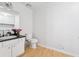 Clean bathroom featuring a sink, toilet, and washer-dryer hookups at 2470 Woodmere Dr, Marietta, GA 30068