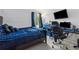 Cozy bedroom with dark wood bed frame, blue bedding, carpeted floors and computer setup at 2470 Woodmere Dr, Marietta, GA 30068