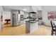 Spacious kitchen with a center island, modern appliances, and a seamless view into the dining area at 2470 Woodmere Dr, Marietta, GA 30068