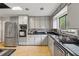 Kitchen featuring stainless steel appliances, light gray cabinetry, and modern countertops at 2470 Woodmere Dr, Marietta, GA 30068