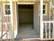 Spacious interior of the shed featuring natural light with open doors on the porch and interior wood paneling at 2470 Woodmere Dr, Marietta, GA 30068