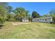Spacious backyard features large, grassy lawn, basketball court, and detached shed at 2804 Carolyn Se Dr, Smyrna, GA 30080
