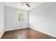 Neutral bedroom features hardwood floors and natural light from a window at 2804 Carolyn Se Dr, Smyrna, GA 30080