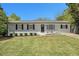 Charming single-story home boasts a well-manicured lawn and fresh exterior paint at 2804 Carolyn Se Dr, Smyrna, GA 30080