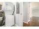 Hallway features laundry area with stacked washer/dryer and access to additional rooms at 2804 Carolyn Se Dr, Smyrna, GA 30080