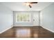 Bright living room features hardwood floors, neutral paint, and plenty of natural light at 2804 Carolyn Se Dr, Smyrna, GA 30080