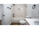 Nicely tiled bathroom with updated shower and white vanity and fixtures at 754 Fayetteville Se Rd, Atlanta, GA 30316