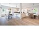 Bright, open concept dining and kitchen area features hardwood floors and modern lighting at 754 Fayetteville Se Rd, Atlanta, GA 30316