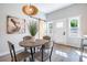Dining room with barn door, modern lighting and view to outdoor entrance at 754 Fayetteville Se Rd, Atlanta, GA 30316