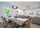 The dining area features a stylish pendant light fixture and flows into the living space, ideal for entertaining at 754 Fayetteville Se Rd, Atlanta, GA 30316