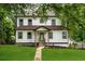 Charming two-story home with a well-manicured lawn and covered front porch in a desirable neighborhood at 754 Fayetteville Se Rd, Atlanta, GA 30316