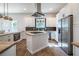 Modern kitchen with white cabinets, stainless steel appliances, wooden counter and stylish backsplash at 754 Fayetteville Se Rd, Atlanta, GA 30316