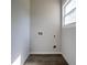 Empty laundry room features tile floors, light grey walls, and a window for natural light at 754 Fayetteville Se Rd, Atlanta, GA 30316