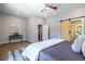 A comfortable bedroom with modern barn door, hardwood floors, and recessed lighting at 754 Fayetteville Se Rd, Atlanta, GA 30316