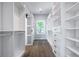 A well-organized walk-in closet with custom shelving, drawers, and ample storage space at 754 Fayetteville Se Rd, Atlanta, GA 30316