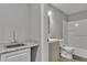 Bathroom featuring a sink, toilet, and bath with shower at 818 Prada Ct, Lawrenceville, GA 30043