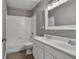 Bathroom featuring a tub/shower combo and double sink vanity at 818 Prada Ct, Lawrenceville, GA 30043