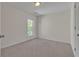 Bedroom featuring neutral carpet and a bright window at 818 Prada Ct, Lawrenceville, GA 30043